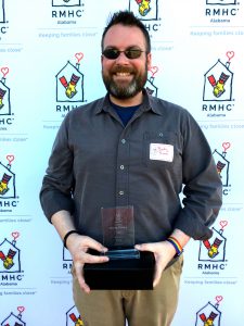 Rocky Prince poses with his volunteer award