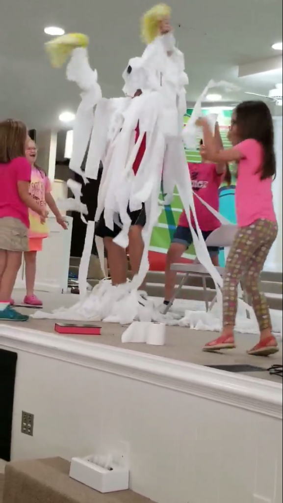Mt. Zion Baptist Church Vacation Bible School kids toilet paper their youth minister after winning a contest to raise the most money for RMHCA