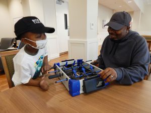 L-R: Christian and Chris play a tabletop game.